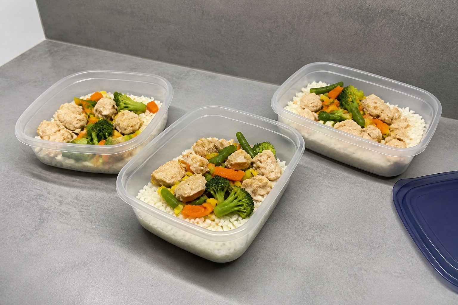 Homemade meals portioned into glass containers