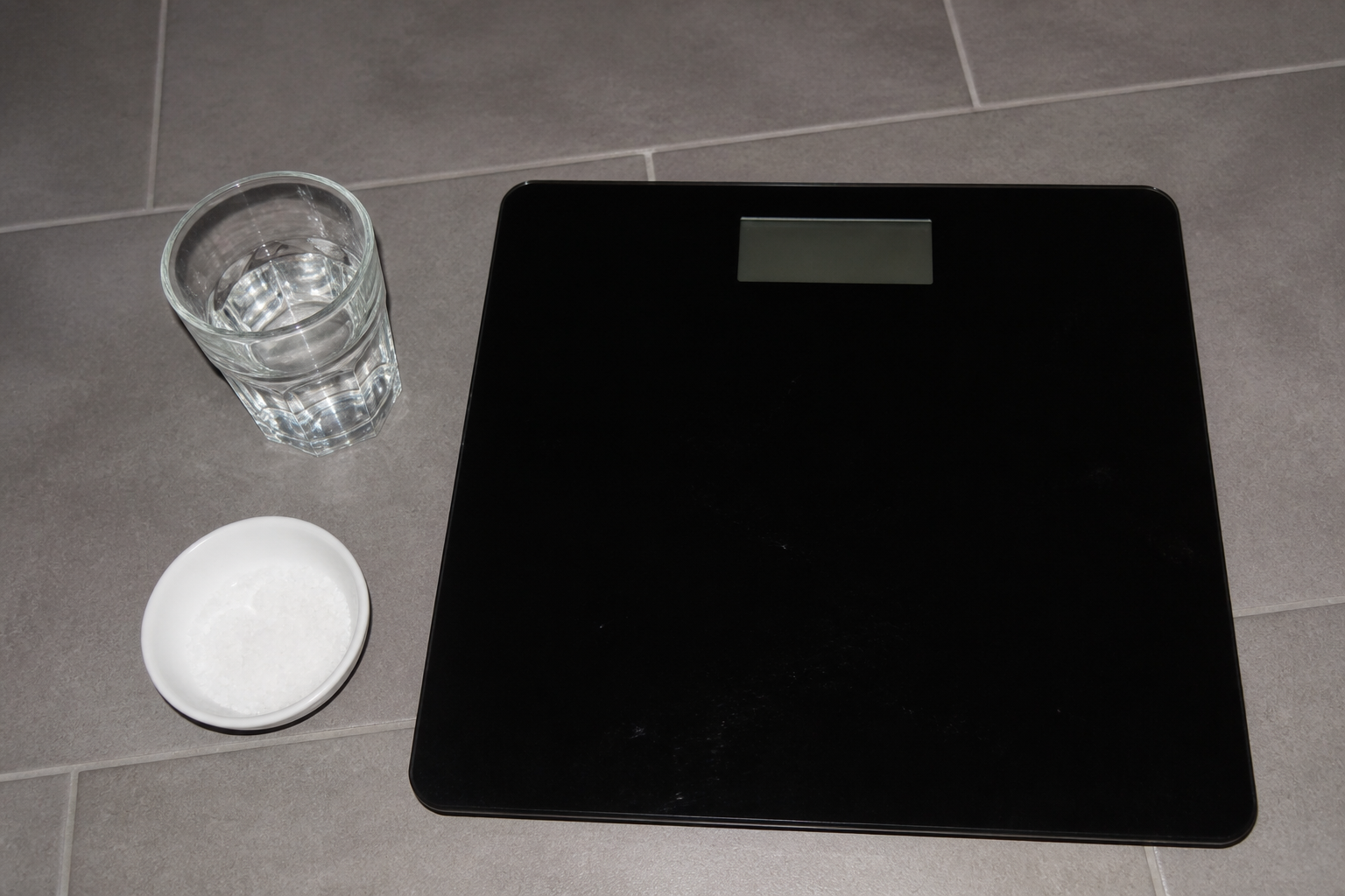 A scale, water glass and ordinary meal