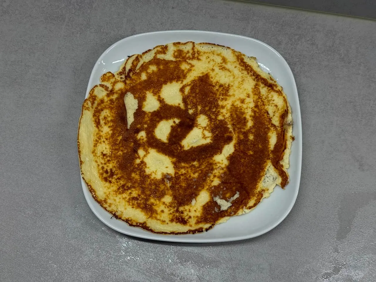Quark pancakes close up, golden brown surface